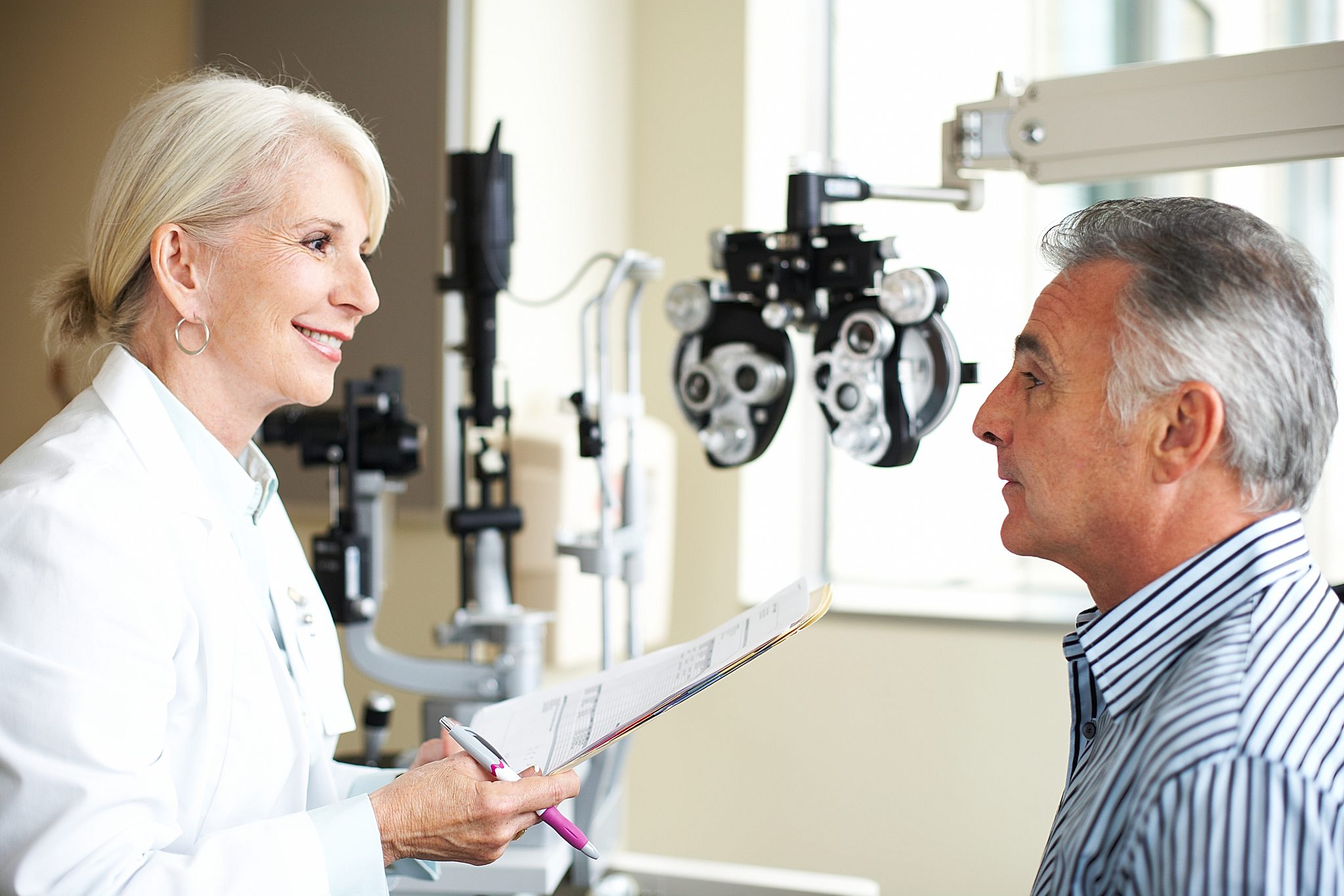 Eye exam with doctor and patient.